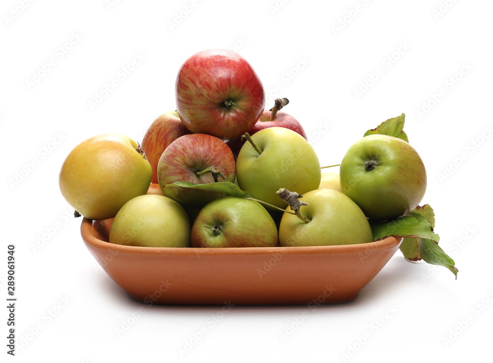 Wild apples in clay pot, bowl isolated on white background Wild apples in clay pot, bowl isolated on white background