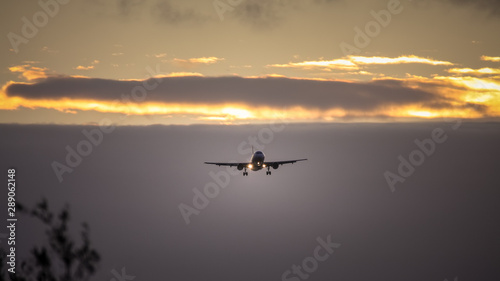 air plane in sunset sky © magann