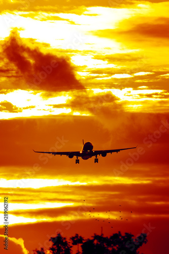 air plane in sunset sky