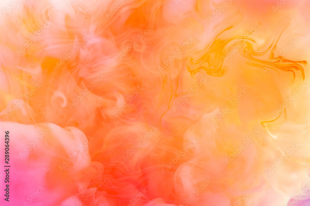 Paints dissolved in water with a beautiful spectacular blur. Trending neon colors. Bright amazing abstract background. Smoke effect.