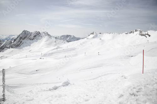 Snow slopes with snow-covered mountains in the background © Root-Couture