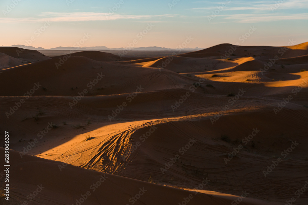 Gorgeous and scenic desert sunset scene above beautiful sand dunes Erg Chebbi, Morocco, Merzouga