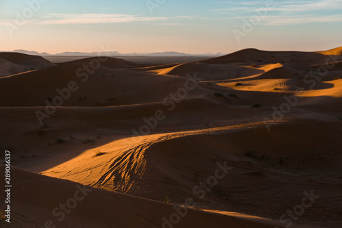 Gorgeous and scenic desert sunset scene above beautiful sand dunes Erg Chebbi, Morocco, Merzouga