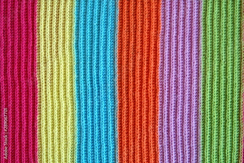 multicolored woolen soft texture stripped. striped pattern fabric wool. multicolored woolen soft texture. knitted blanket from multi-colored threads. Knitted texture. Strips Backgrounds.