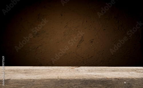 Empty wood table top on blur light gold bokeh of cafe restaurant in dark background