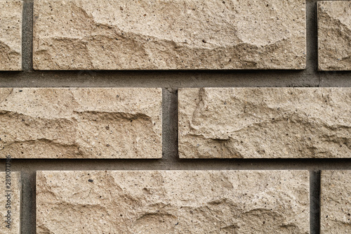 texture of a brick wall on the street with strong