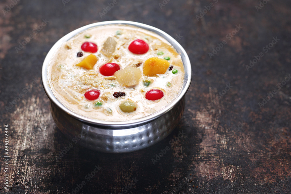 Thai soup with fresh vegetables. Creamy soup with tomatoes, manga, coconut milk
