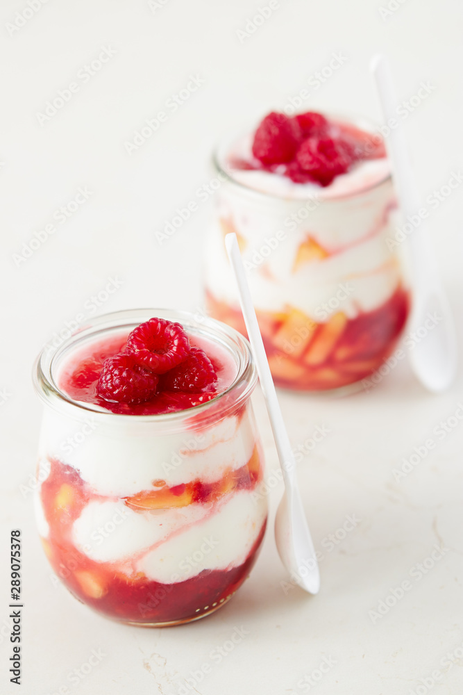 Peach and raspberry dessert with yogurt cream Peach and raspberry dessert with yogurt cream