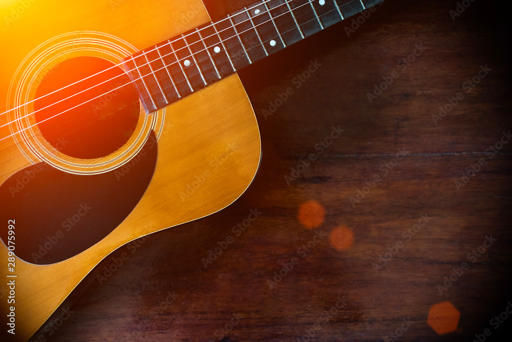 Fototapeta premium Close-up of of brown wooden acoustic classical guitar.