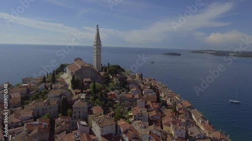 Pull back aerial drone shot over Rovini old town, city centre in Croatia. photo