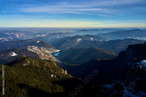 Aerial Landscape view from Ceahl  u Mountains National Park at sunrise in winter season