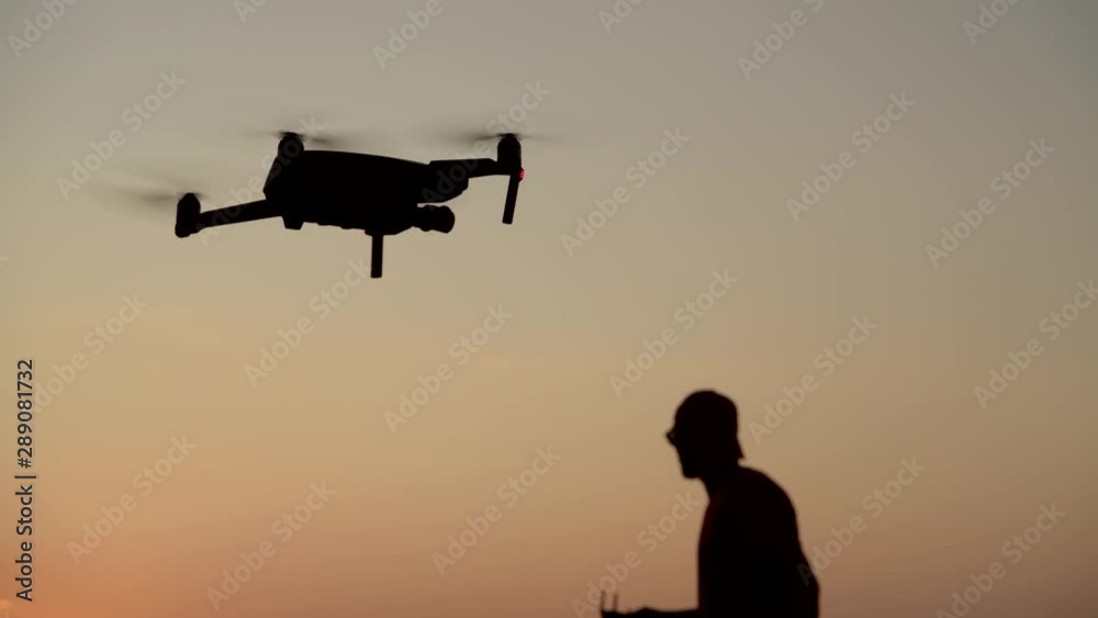 Young Males Flying Their Drones Across the Meadow. Aircrafts Technologies.