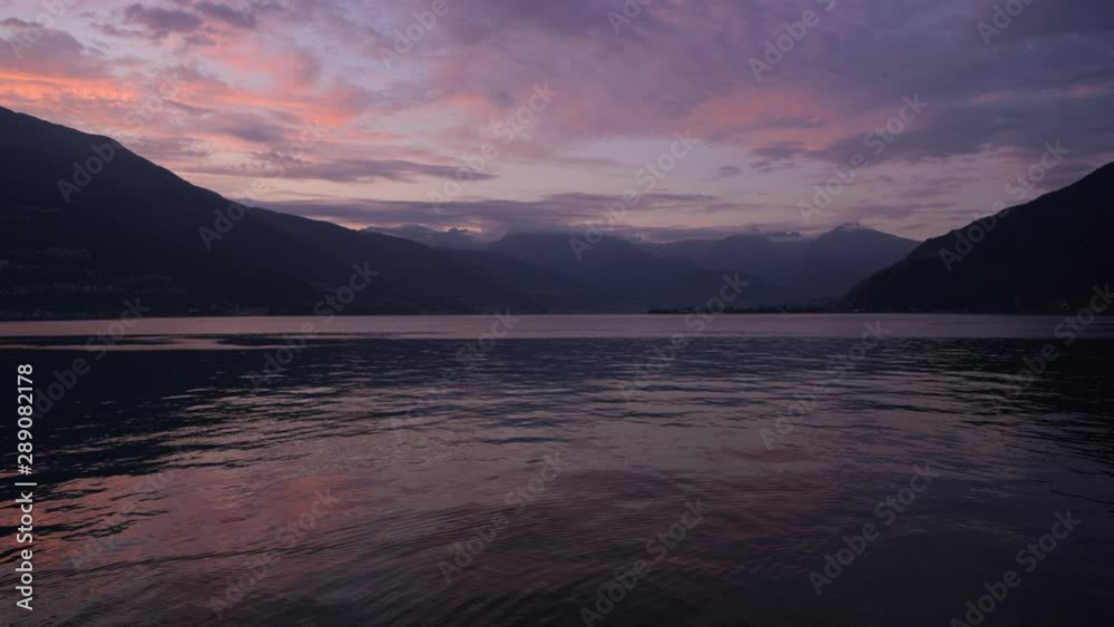Scenic Lake Como Sunset. Photo Taken From the City of Bellano Waterfront Promenade. Italian Famous Destination. Scenic Lake Como Sunset. Photo Taken From the City of Bellano Waterfront Promenade. Italian Famous Destination.