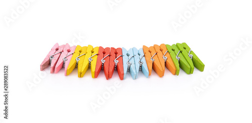 Colorful wooden clothespin isolated on white background