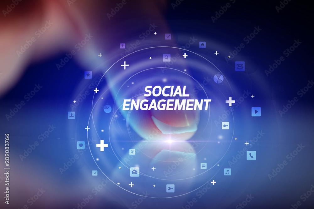 Finger touching tablet with social media icons and SOCIAL ENGAGEMENT