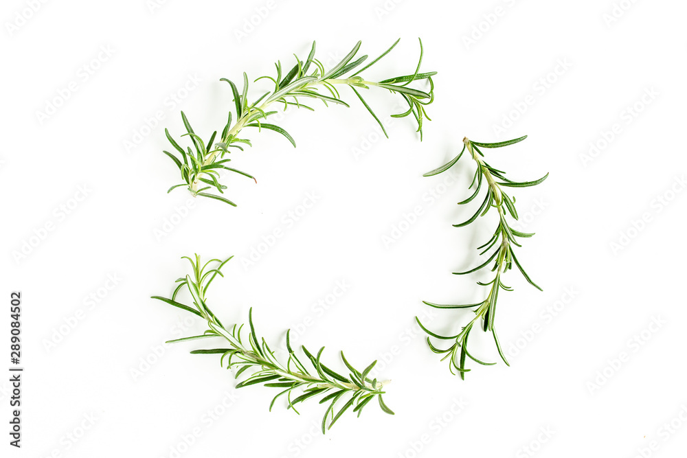 Fototapeta premium Round wreath frame made of mix of herbs, green branches, leaves rosemary and thyme. Set of medicinal herbs. Flat lay. Top view.