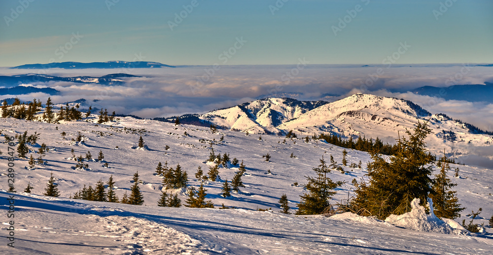 Amazing Landscape view from Ceahlau Mountains witn Sea of clouds in winter season, Aerial winter Landscape in National Park Ceahlau