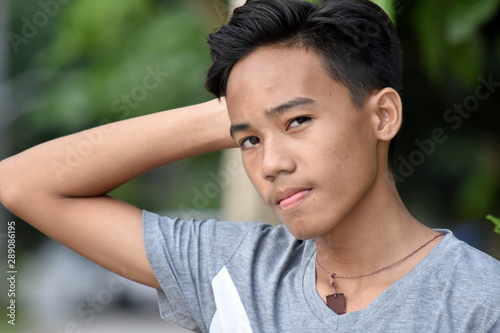 An Unemotional Filipino Teenager Boy