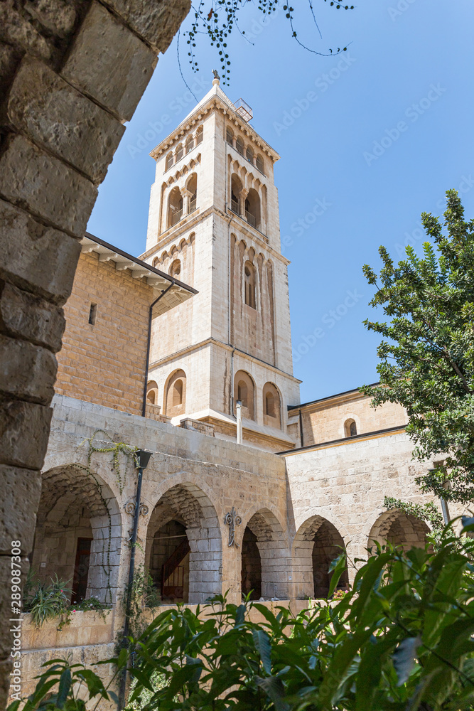 View from the courtyard to the bell tower of the Lutheran Church of the Redeemer on Muristan street in the Old City in Jerusalem, Israel