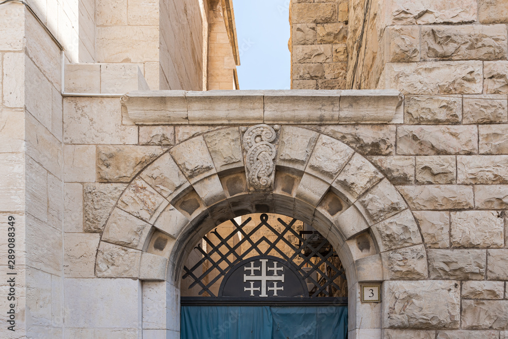 Fototapeta premium Arch above the entrance to the building of the Danish Church on Muristan street in the Old City in Jerusalem, Israel