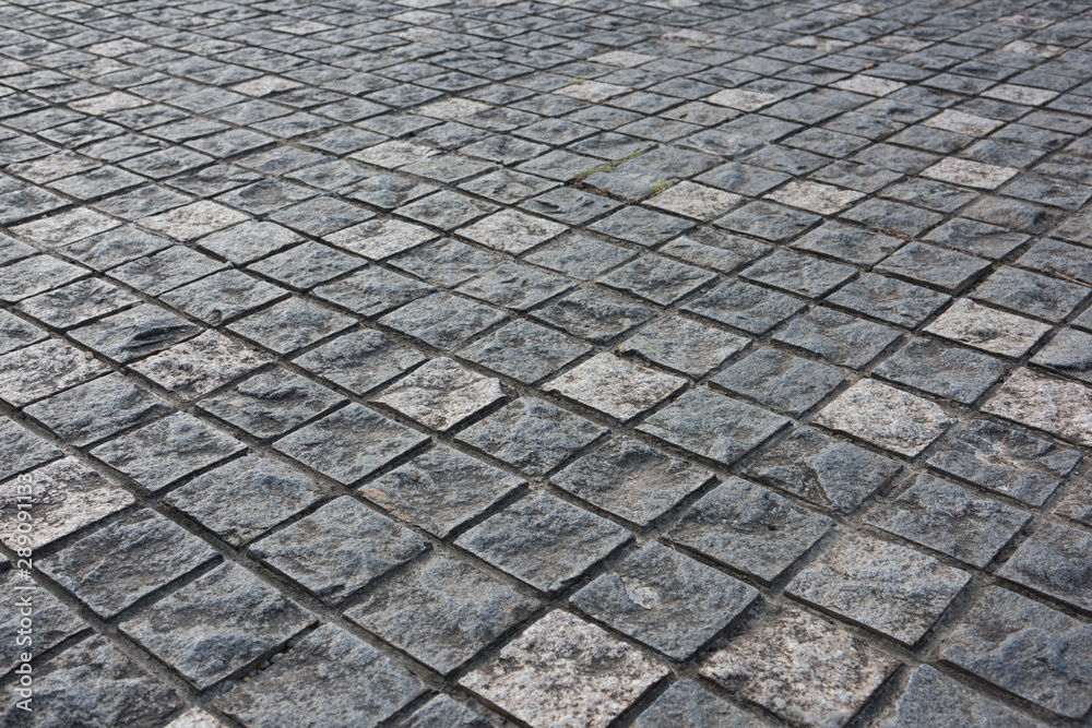 Fototapeta premium Ancient Roman Square Stone Road Low Angle Closeup
