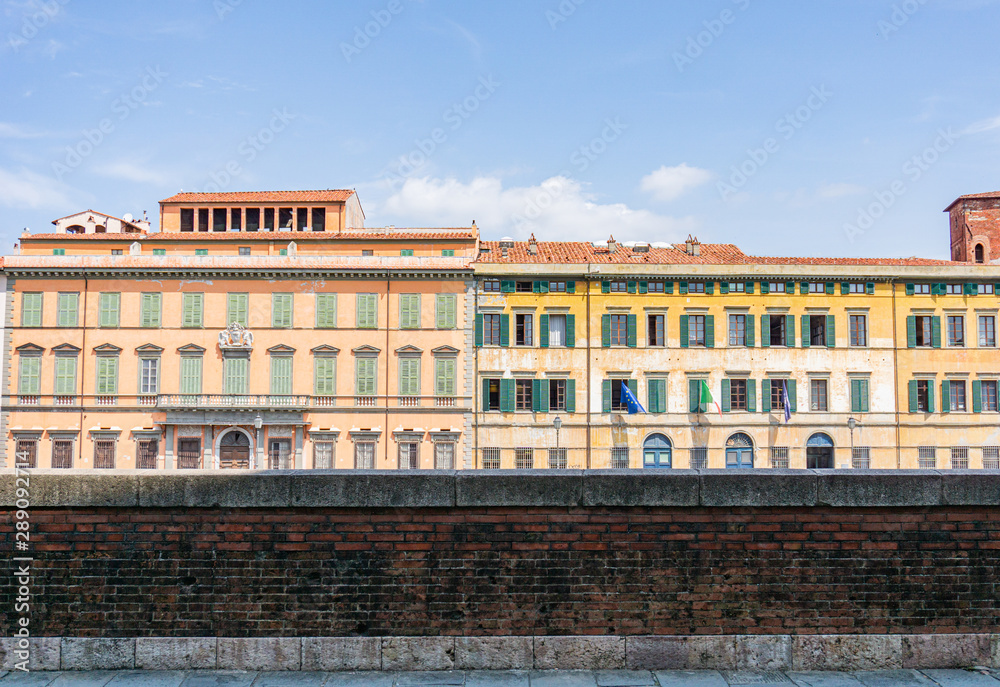 View of the street with beautiful, colorful buildings in Pisa,Tuscany, Italy