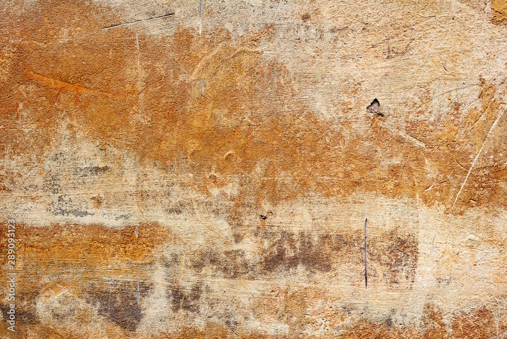 Fototapeta premium Texture of a concrete wall with cracks and scratches which can be used as a background