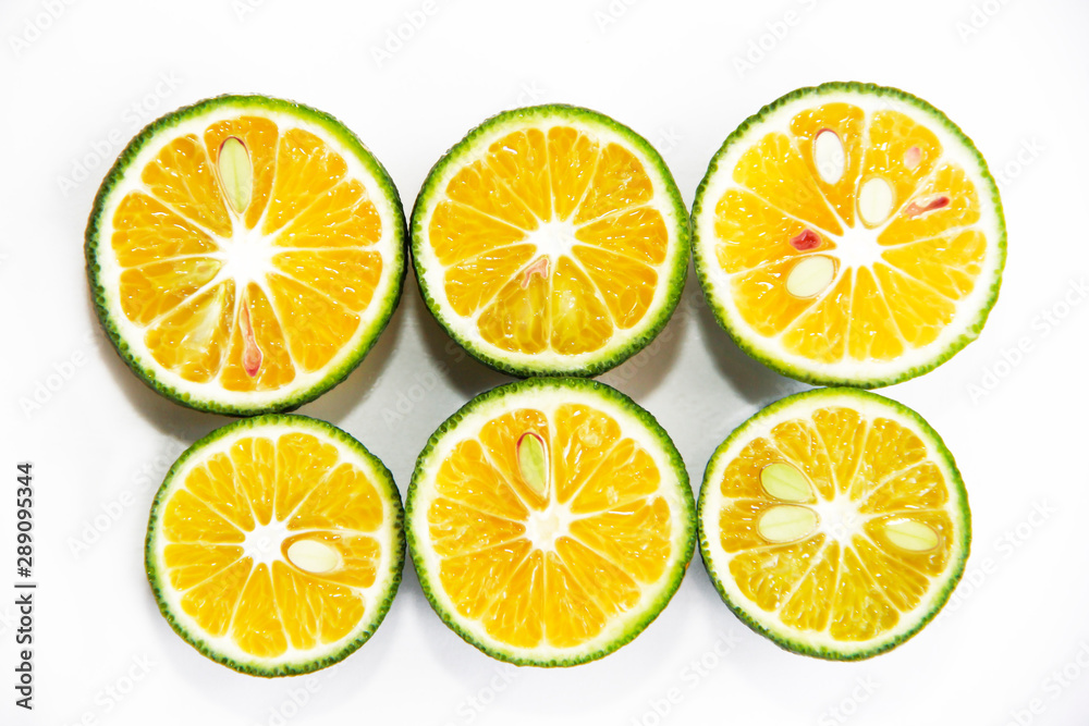round slices of natural fresh tangerines, oranges, lemon, lime with green peel