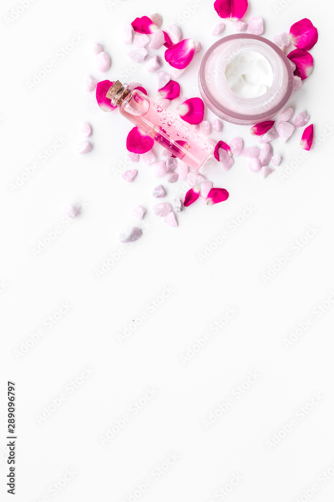 Obraz little stones and rose cosmetics mock up on white background top view