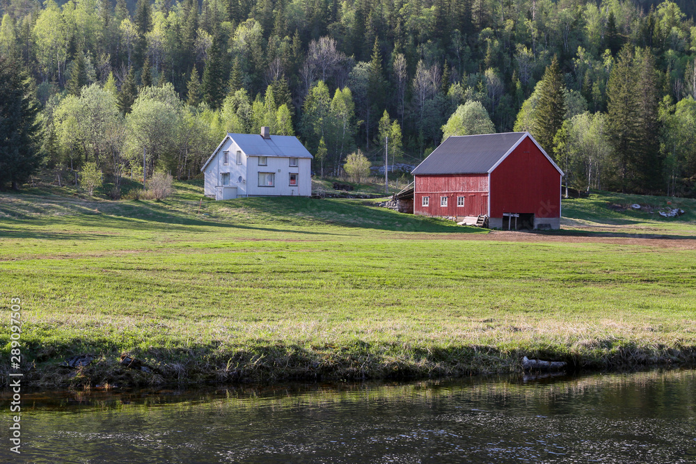 Smal old farm by the river in Northern Norway
