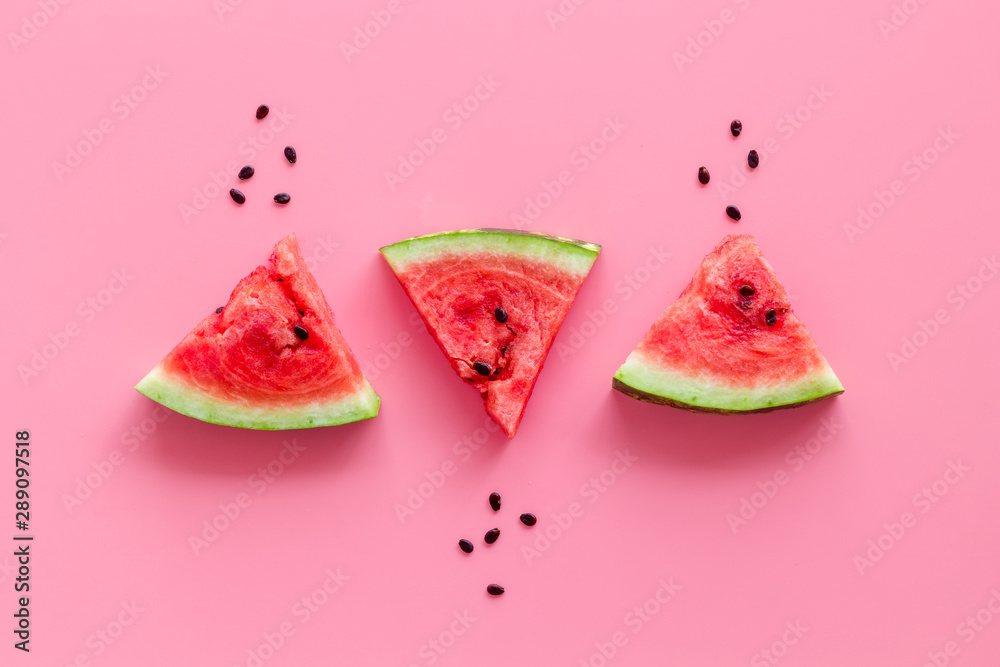 Popsicle from fresh watermelon on pink background top view