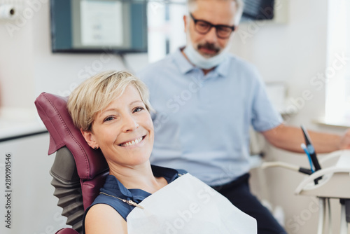 Smiling happy woman in a dental surgery