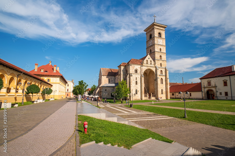 Main street in old fortress city Alba Iulia and St. Michael's Catholic Cathedral, Alba Iulia, Transylvania, Romania
