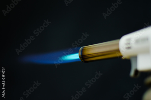gas flame gun torch blue fire butane white background