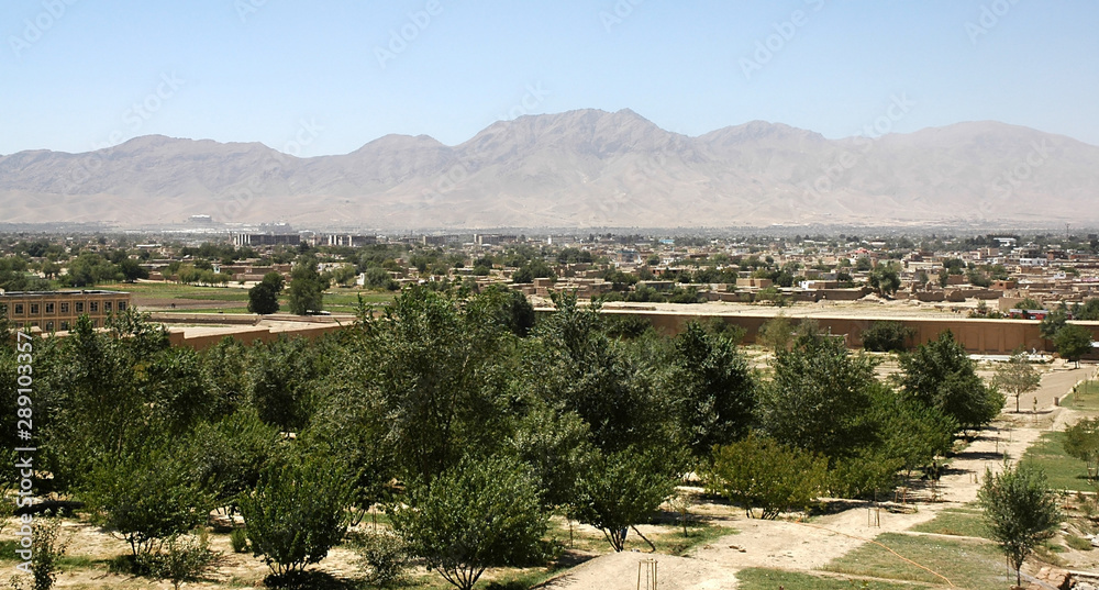 View of Kabul, Afghanistan taken from the Gardens of Babur during reconstruction of the gardens. Kabul city view with trees and mountains. View from the Gardens of Babur, Kabul, Afghanistan 2005.