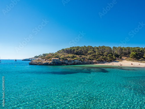 Fototapeta Naklejka Na Ścianę i Meble -  Mondragó Natural Park Mallorca Spain June 1 2019 in the bay with the sandy beach and the headland into the mediterranean