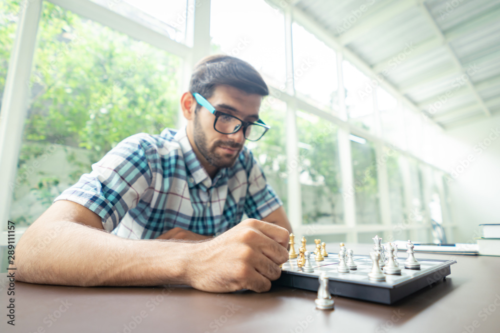 Casual businessman playing chess game with retro style photo, in business competition and planning strategies concept. Casual businessman playing chess game with retro style photo, in business competition and planning strategies concept.
