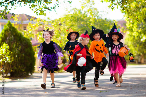 Kids trick or treat. Halloween fun for children. photo