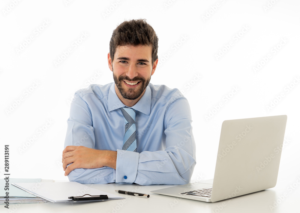 Attractive happy Young caucasian businessman working on laptop computer feeling successful at work Attractive happy Young caucasian businessman working on laptop computer feeling successful at work