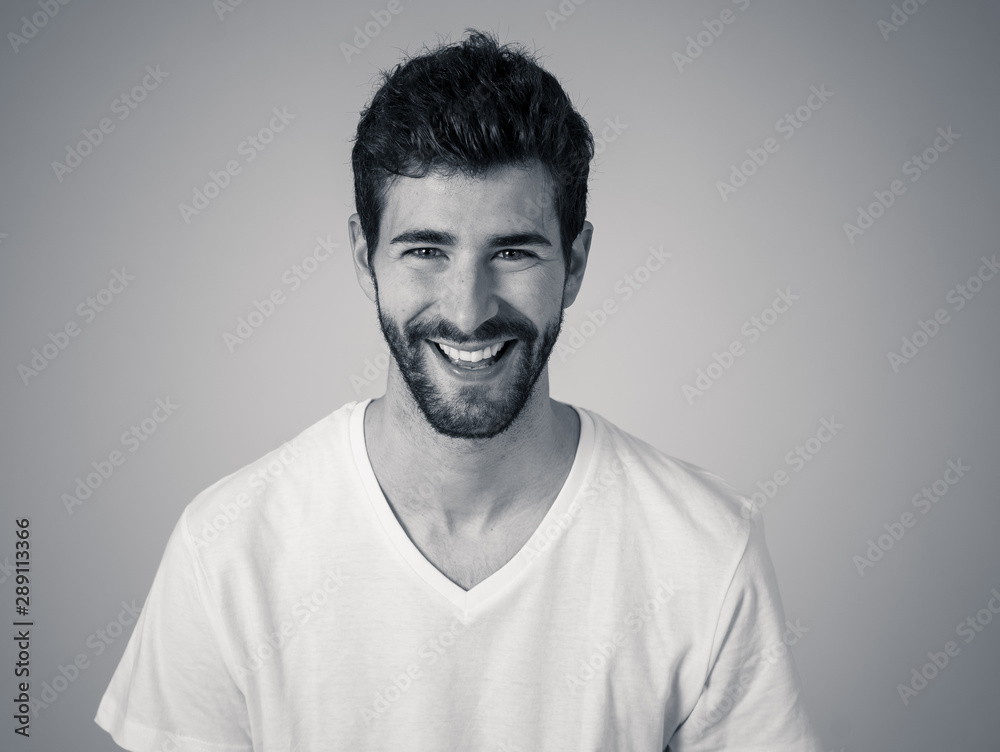 Portrait of attractive cheerful young man with smiling happy face. Human expressions and emotions Portrait of attractive cheerful young man with smiling happy face. Human expressions and emotions