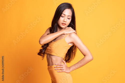 Young Asian woman got back pain.