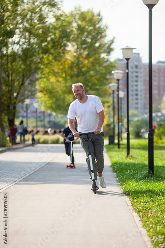 Man with scooter © Ivan Kulikov