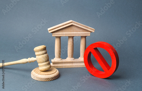 Courthouse with judge's gavel and sign NO. concept of censorship and the production of restrictions and laws on restriction. Anti-popular laws, usurpation of power, conservative views. Lack of justice photo