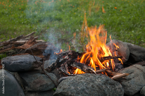 A bonfire on a stone fireplace.