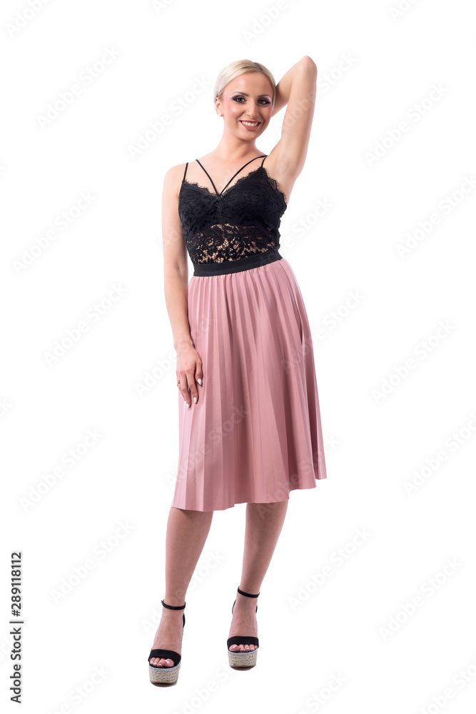 Happy pretty blonde girl in stylish elegant clothes posing and smiling at camera. Full body isolated on white background.