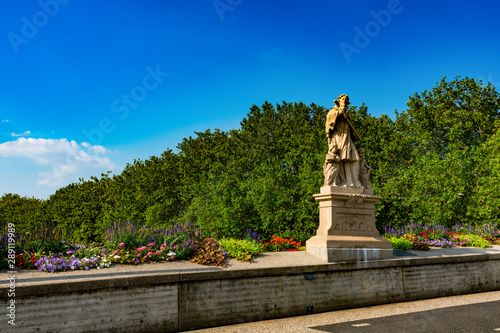 bridge with flowers and Sculpture, over river Ems, in Rheine, Germany photo