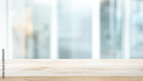 Obraz na plátne Selective focus of wood table top on white wall glass background