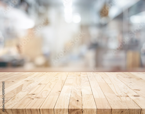 Wood table,counter island on blur kitchen room background.For montage product display or design key visual photo