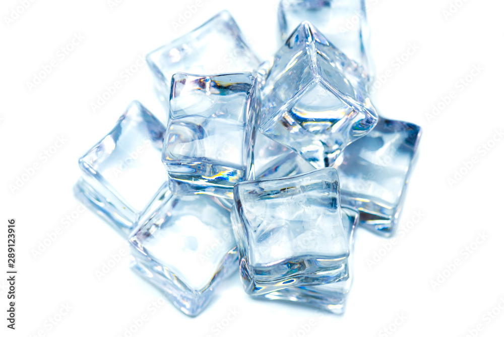 Eight wet ice cubes isolated on white background.Heap of melting ice on the plate. Eight wet ice cubes isolated on white background.Heap of melting ice on the plate.
