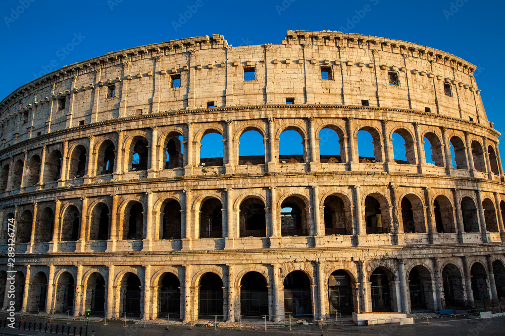 Naklejka premium The famous Colosseum under the beautiful light of the golden hour in Rome